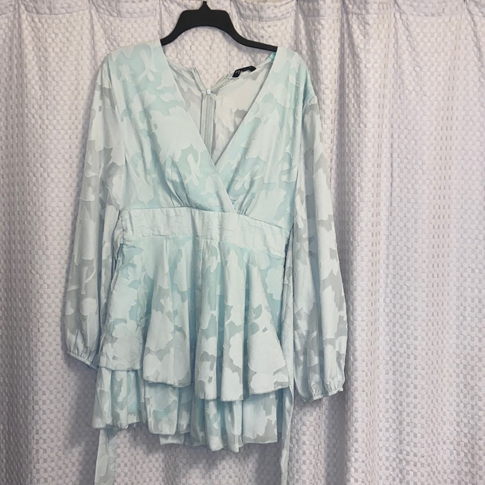 Mint green romper that looks like a dress and ties in the front. Size Large